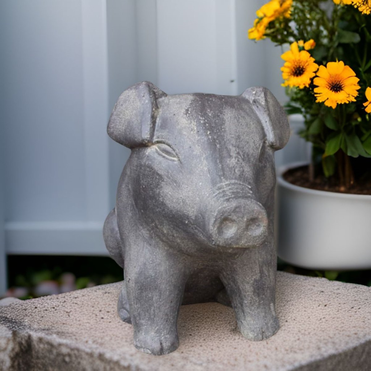 Gartenstatue sitzendes Schwein aus Steinguss